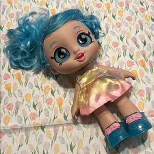 Shopkins Kindi Kids Jessicake Blue-Haired Kids Fashion Doll in Pink/Yellow Dress
